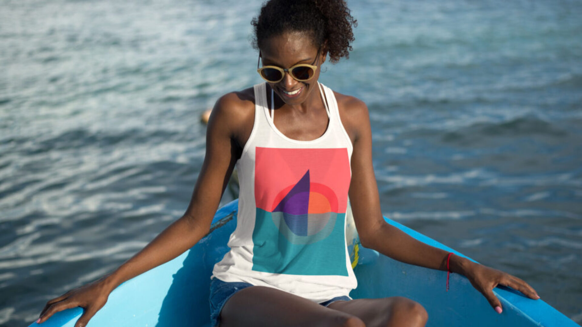 beach-tank-top-mockup-featuring-a-lovely-woman-on-a-boat-in-the-sea-a12743